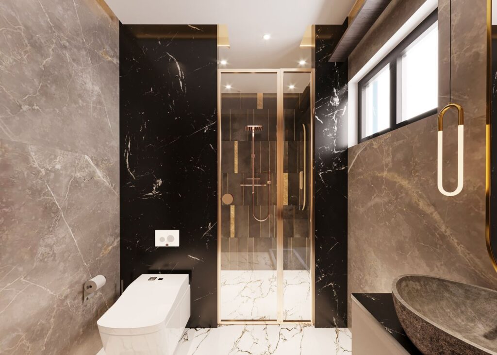 Elegant bathroom with marble decor and modern fixtures featuring a shower, toilet, and basin.