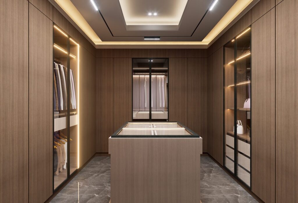 Luxurious walk-in closet with sleek wooden cabinets and stylish lighting.